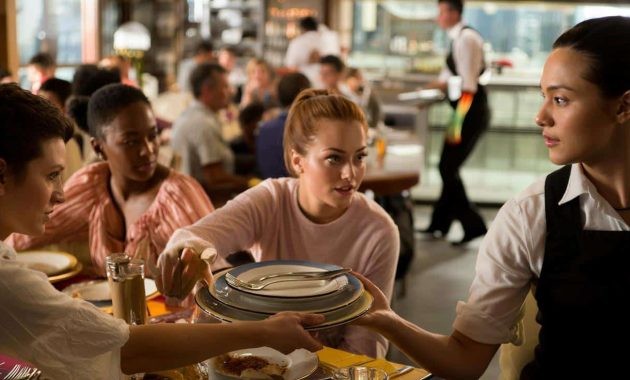 What does it mean, according to psychology, when you help waiters clear the table at a restaurant?